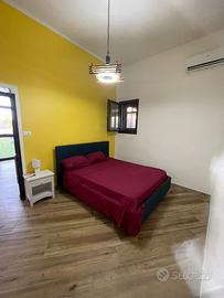 Mini appartamento e stanze con bagno in camera