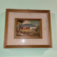 Quadro vintage incorniciato con paesaggio rurale
