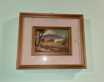 Quadro vintage incorniciato con paesaggio rurale