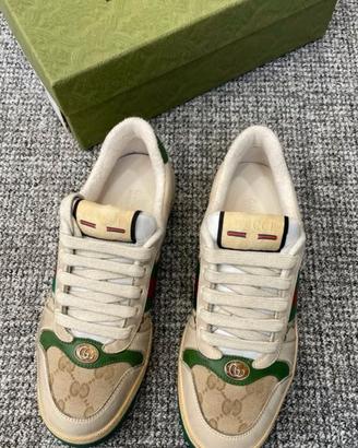 Sneakers basse con lacci e smalto GG