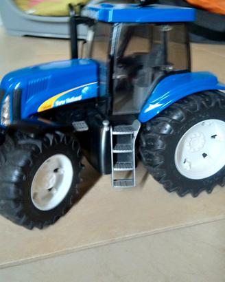 trattore  giocattolo new holan blu ( marca Bruder)