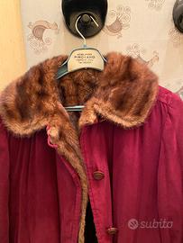 Cappotto vintage in pelle con pelliccia interna