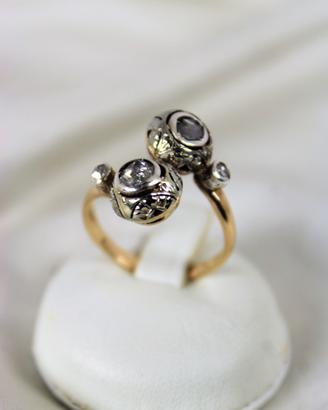 Antico anello " contrarié " in oro 18K e diamanti