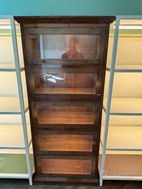 Libreria con ante a ribalta in vetro