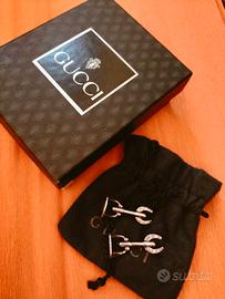 Gemelli Gucci argento.