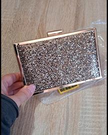 pochette Benetton oro
