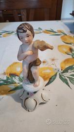 Statuetta vintage puttino con violino