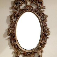 Specchio antico ovale intagliato argentato