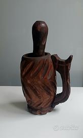 Mortaio con pestello in legno intagliato