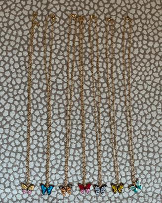 7 Collanine bijoux dorate con farfalline colorate