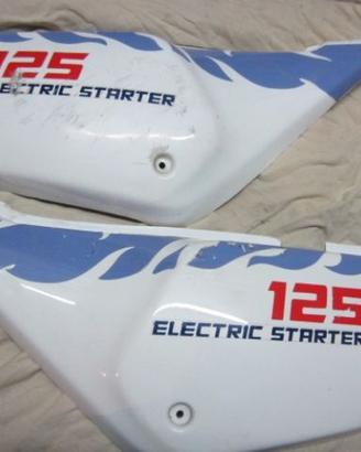 Aprilia Tuareg 125 fiancatine laterali 1987