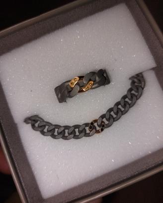anello e bracciale titanio, oro e diamanti neri 