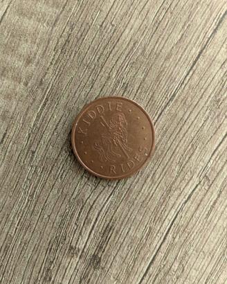 Questo è un gettone per giostre per bambini, noto 