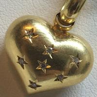 Ciondolo a cuore in oro giallo 750 con brillantini