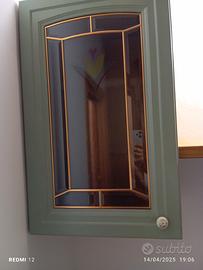 pensile verde con vetro e fiore