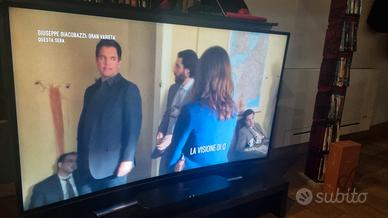 Tv Samsung 55" curvo con soundbar Panasonic