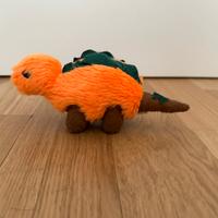 Peluche arancione dinosauro