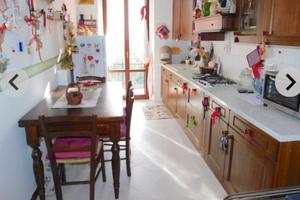 Appartamento con fondo e piccola corte esterna