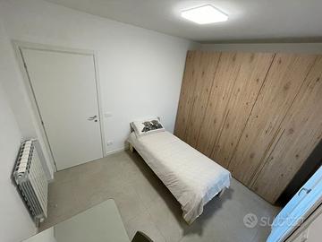 Ampia camera a Dalmine con terrazzo privato