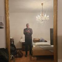 Antica specchiera con cornice in legno