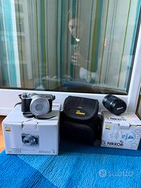 Macchina fotografica Nikon J5 + obiettivo Nikkon