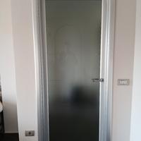 Porta battente in vetro
