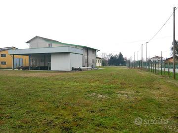 LOTTO EDIFICABILE DI 5.530 mq CON DUE CAPANNONI