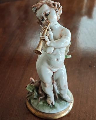 Statua Capodimonte bambino con flauto
