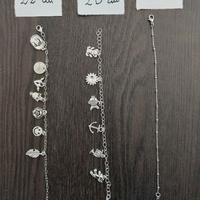 Braccialetti acciaio con ciondoli assortiti