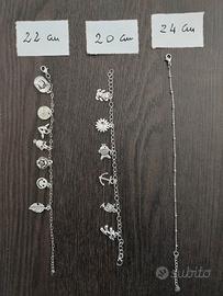 Braccialetti acciaio con ciondoli assortiti