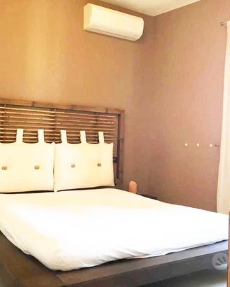 Letto in legno Cinius con testata e comodini