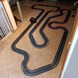 Carrera Go 4 piste con estensioni e 21 slot car