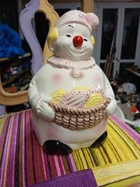 Grazioso salvadanaio a forma di pagliaccio in porc