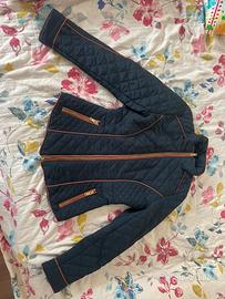 Giacca trapuntata blu con dettagli arancioni