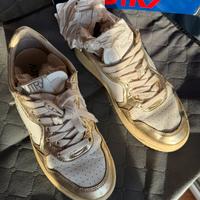 Scarpe in pelle bianca e oro metalizzato Autry