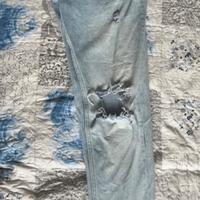 Jeans skinny strappati