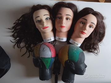 Teste con capelli per parrucchieri e scuola