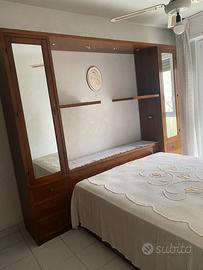 Camera da letto in arte povera