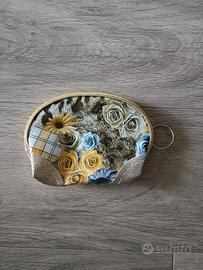 portafoglio/pochette con anello 