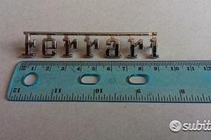 Scritta originale FERRARI in metallo cromato