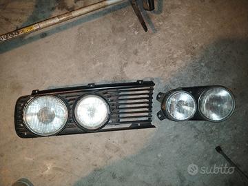 BMW E12, E21, E28, E23, E30, Fari + griglia sx
