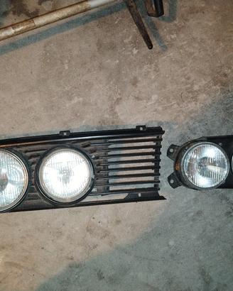 BMW E12, E21, E28, E23, E30, Fari + griglia sx