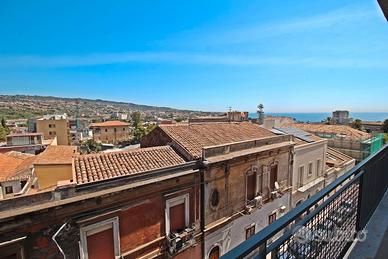 Esavani vista Cartolina Etna e mare di Ognina