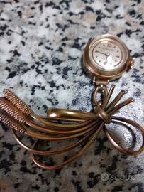 Orologio spilla