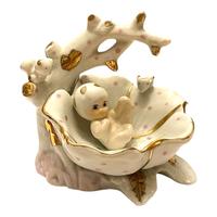 Statuetta decorativa vintage in porcellana dorata