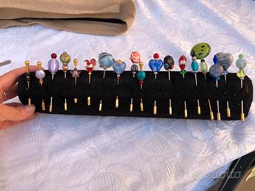 Spilloni con vetro di Murano