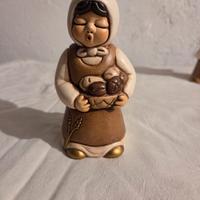 Donna con cesta di pane presepe thun giubileo