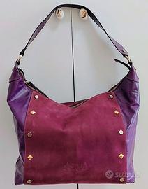 Borsa da donna vera pelle firmata colore fucsia.