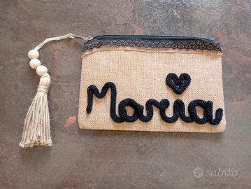 pochette con scritta tricotin