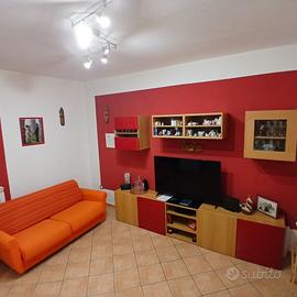 parete attrezzata e divano letto